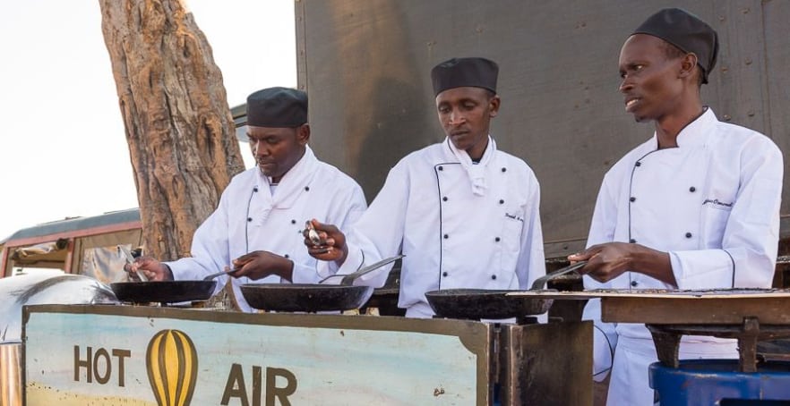 Our breakfast is set up on the picturesque savannah plains of the Mara, typically under the shade of a single balanite tree.